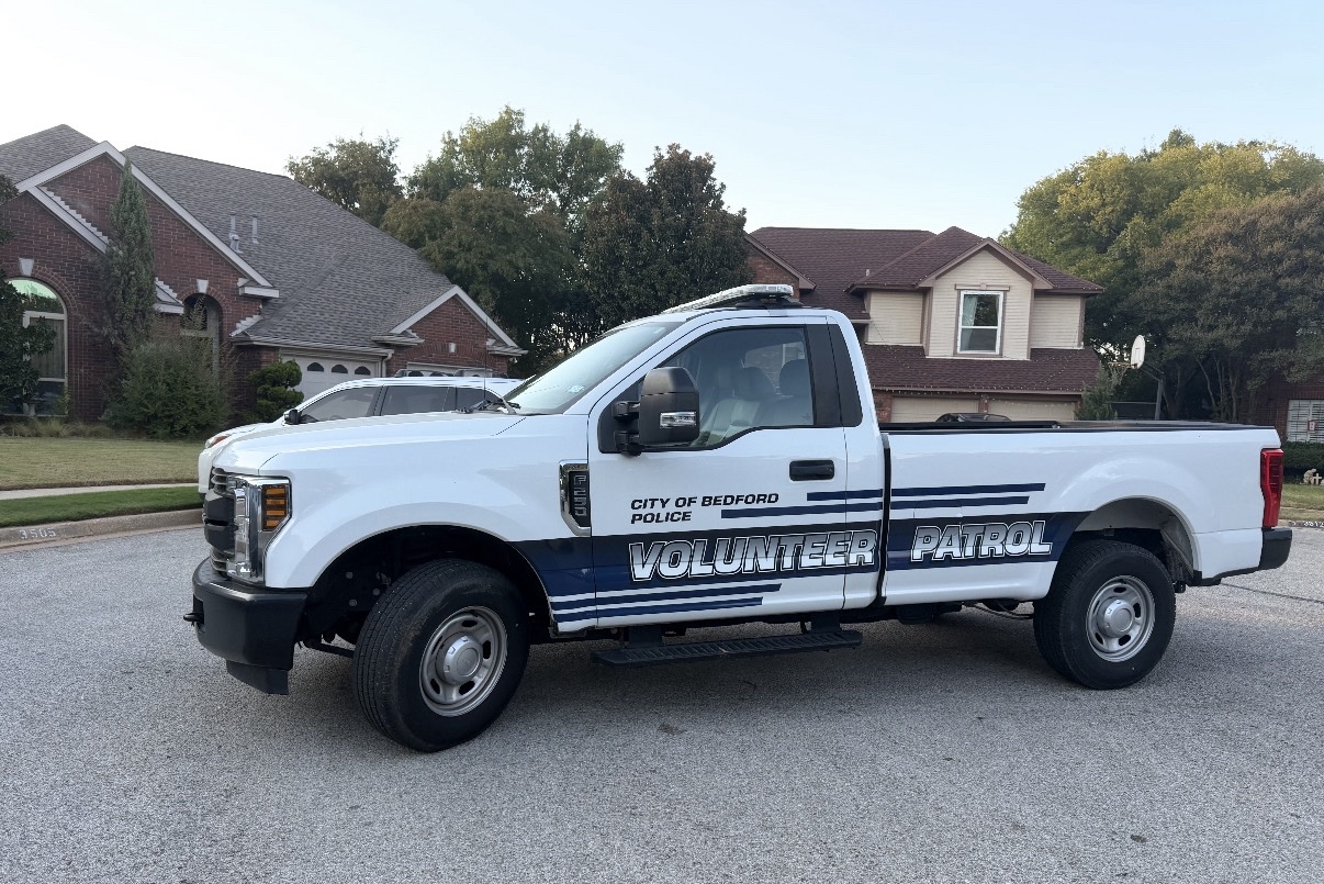 City of Bedford Police Volunteer Patrol truck parked in Rustic Woods