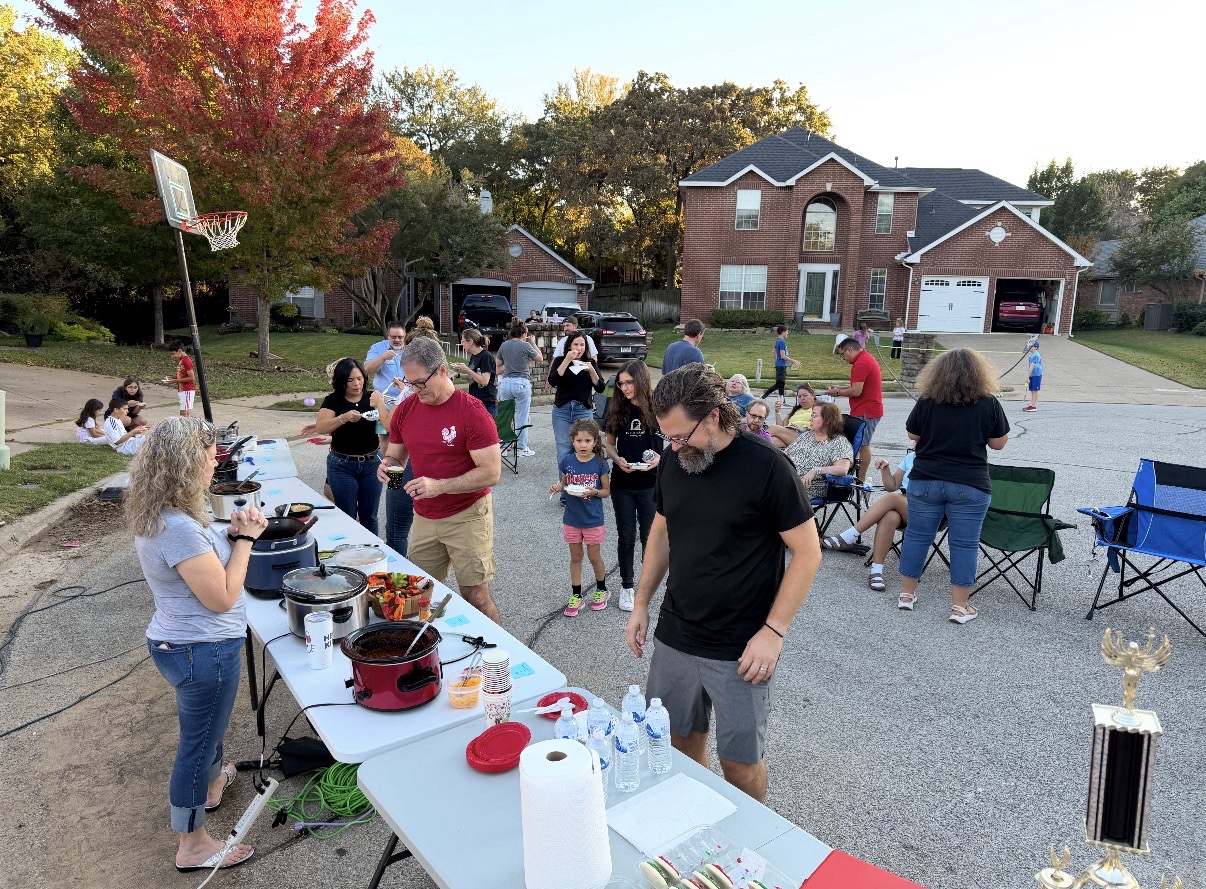 Neighbors tasting chili at the annual RWNA chili cook-off